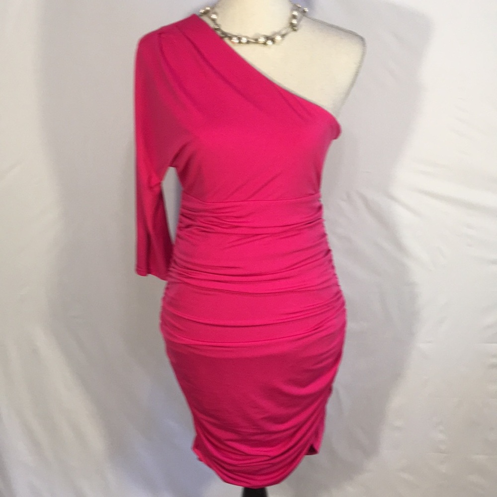 One shoulder dress with roughing at the waist.